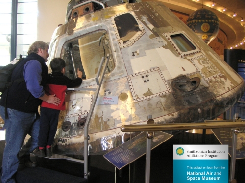 Visitors at the San Diego Air and Space Museum (San Diego, CA) enjoy the Apollo 9 space capsule, affectionately called “Gumdrop”. Originally launched in 1969, it is now on loan from the National Air and Space Museum. Space capsule on loan from Air and Space Museum